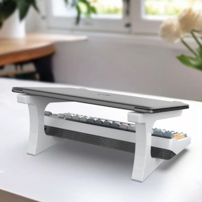 Support ordinateur portable mis en evidence avec un laptop ferme dessus